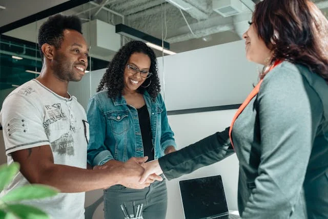 A real estate agent with customers